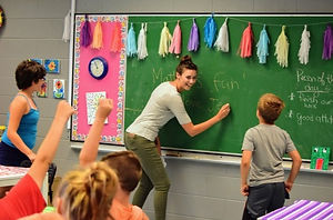 Teacher Jessica Pattison leads students at Milltown Elementary School in St. Stephen through a word game. The school hosts a summer program in literacy and math funded in part by the Million Dollar Pledge. The Million Dollar Pledge is a network of New Brunswick business leaders supporting social causes.